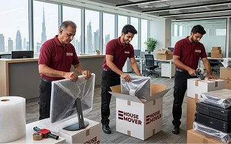 E House Mover Team Carefully Packing Kitchen Items 2 2