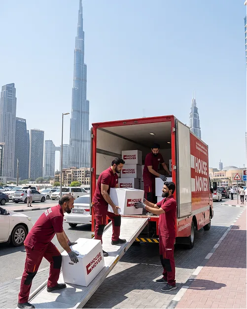 E House Mover Team Loading Boxes for Safe Relocation in Dubai