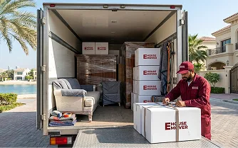 E House Mover Team Loading Sofa into Moving Truck