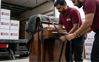 E House Mover Team Securing Furniture for Safe Transport
