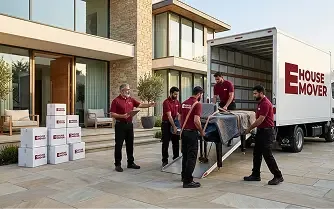 E House Mover team loading protected furniture into a moving truck for a villa relocation in Dubai.