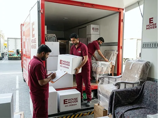 E House Mover UAE team moving furniture
