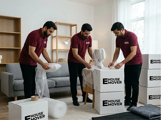 moving team packing items in boxes