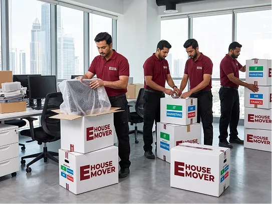 Crew packing and sealing office cartons tagged by department — IT, Marketing, HR and Finance